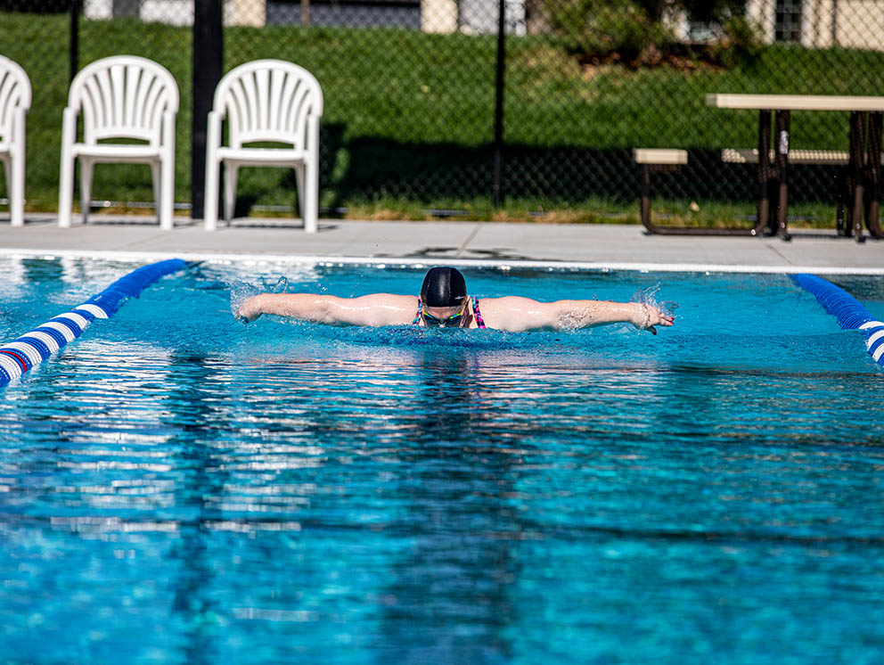 Woman swimming in the Adventure Pool.